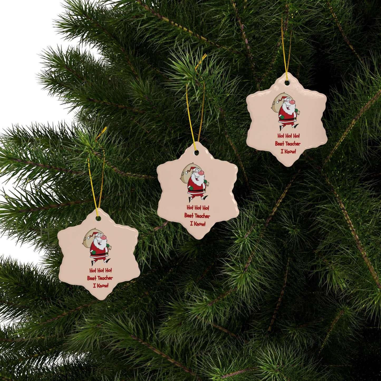 Three star-shaped Christmas ornaments with Santa Claus on a green tree.