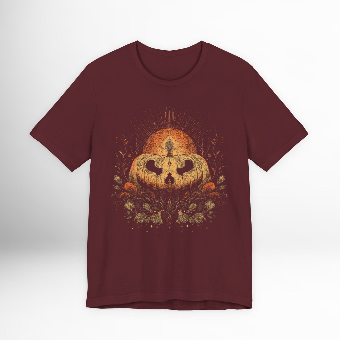 Maroon t-shirt with a pumpkin graphic on a white background