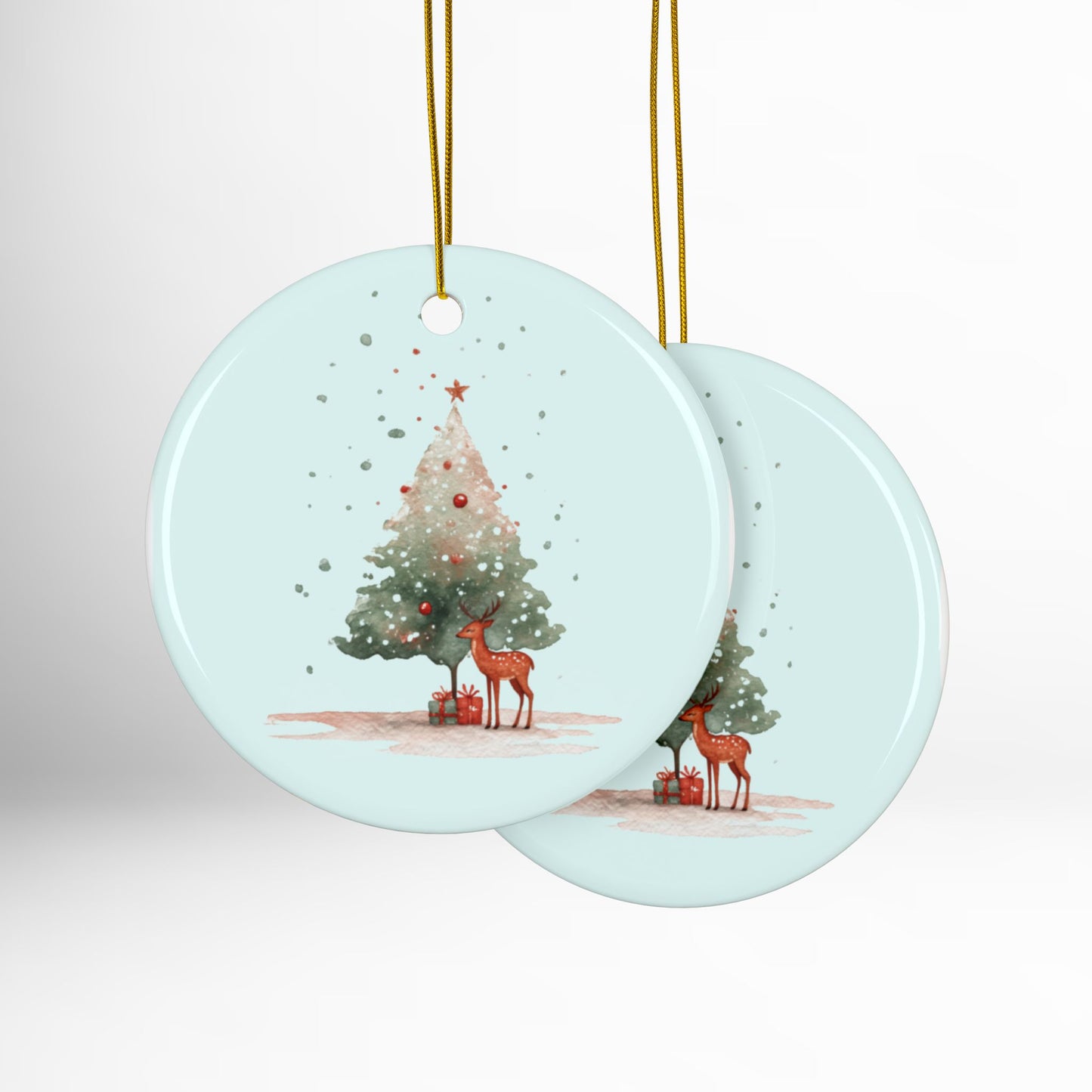 Round Christmas ornament with deer and tree design on a light blue background