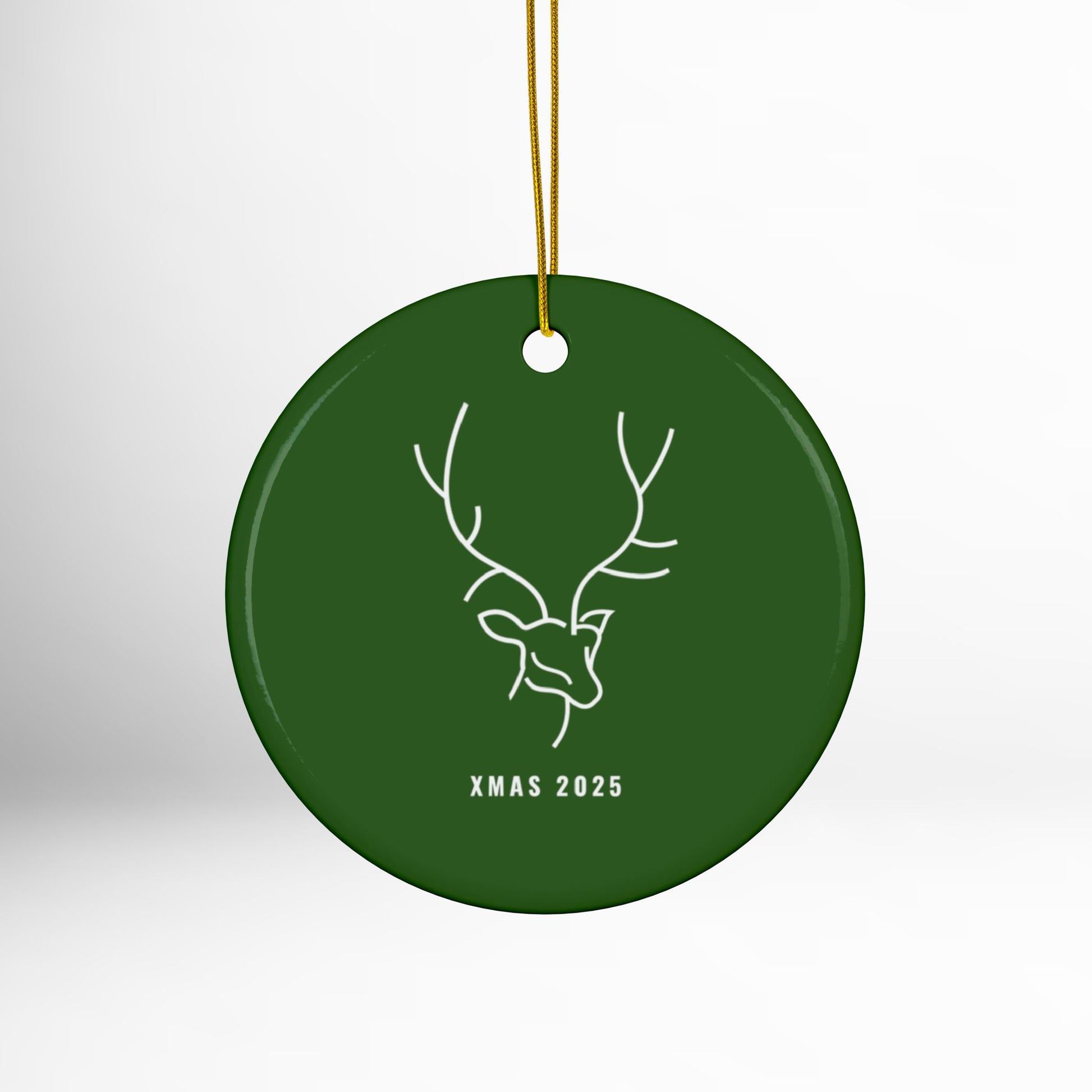 Green Christmas ornament with deer design and 'XMAS 2025' text on a white background