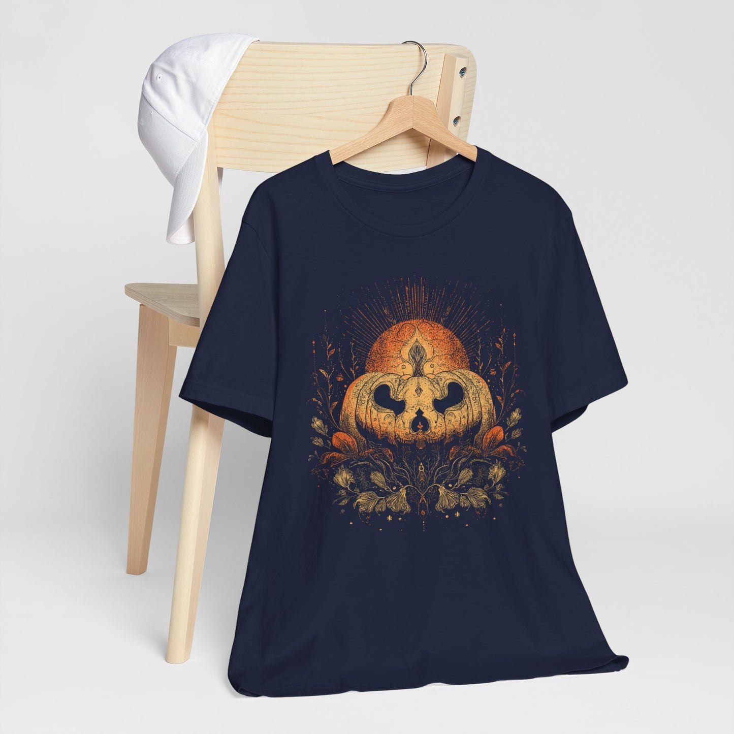 Navy blue t-shirt with a pumpkin and skull design on a white background