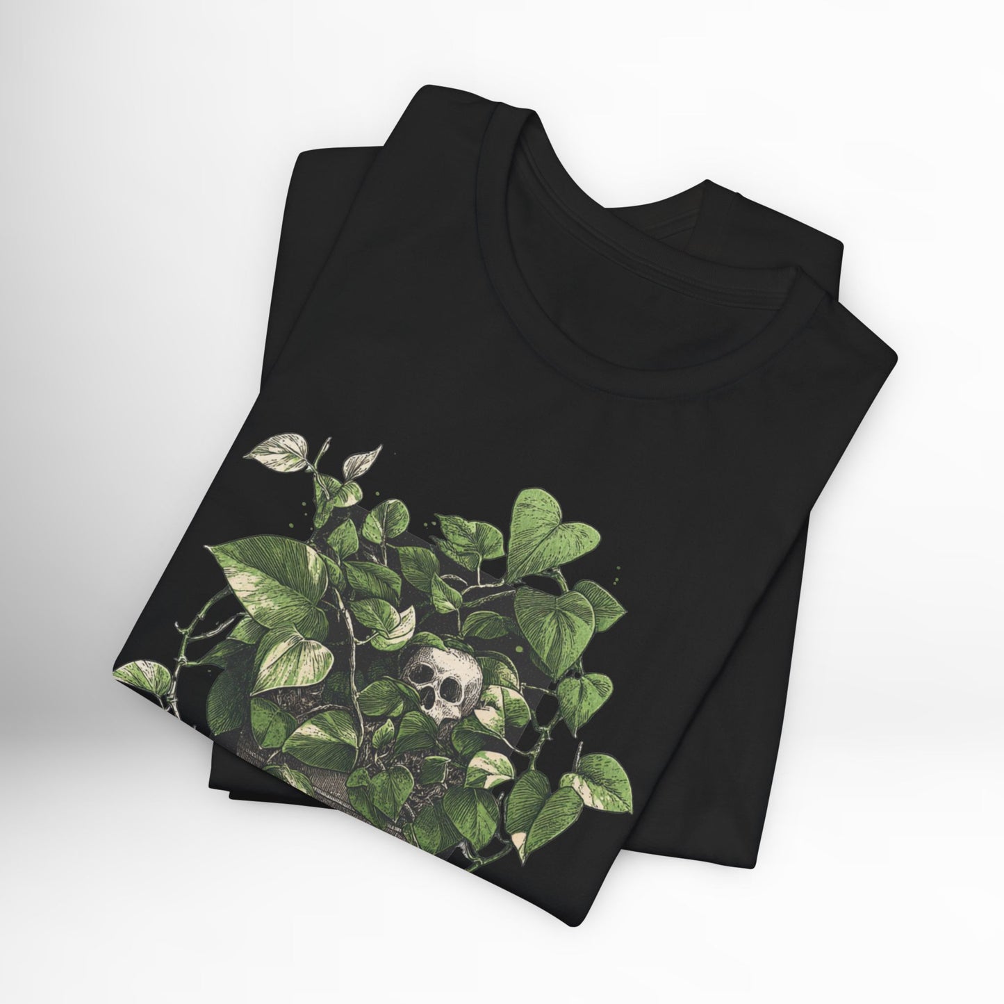 Black t-shirt with green leaf design on a white background