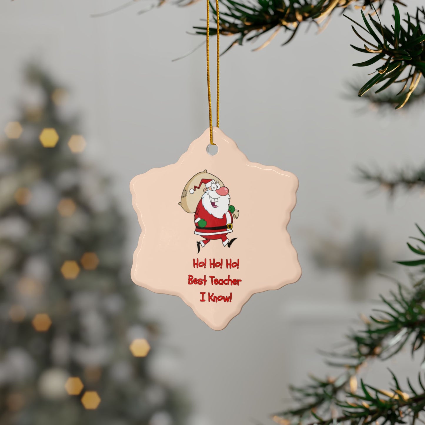 Decorative tag with Santa Claus illustration and text, hanging on a Christmas tree.
