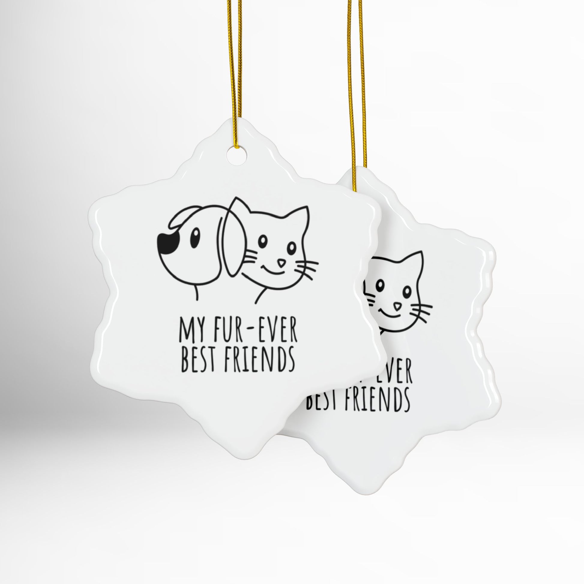 Two star-shaped ceramic ornaments with dog and cat illustrations and text on a white background.