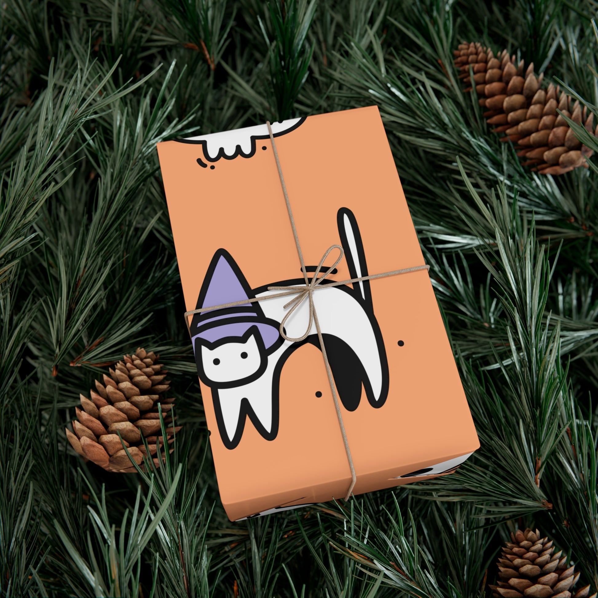 Gift wrapped in orange Halloween wrapping paper with ghost and skull design – festive spooky gift wrap.