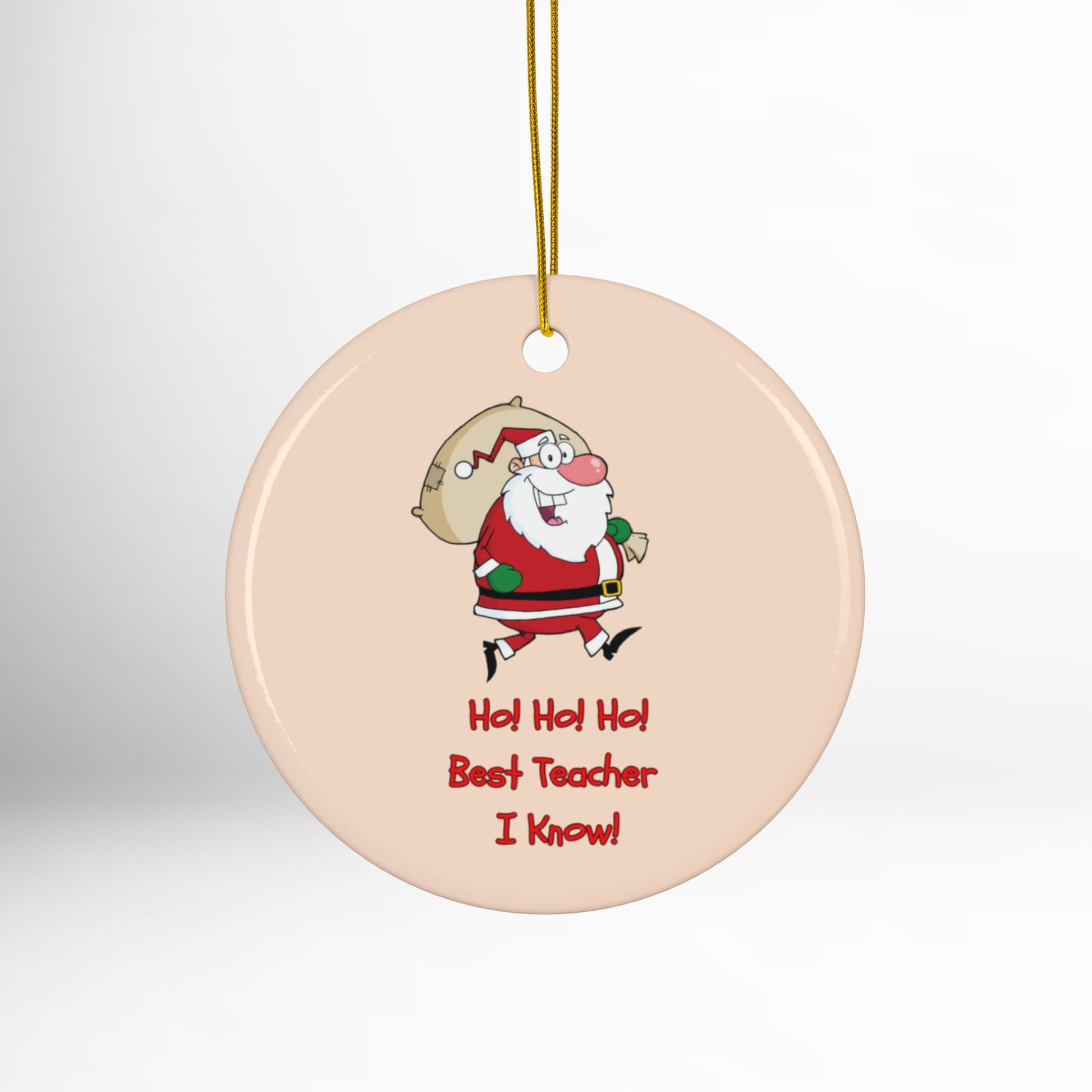 Round ceramic ornament with cartoon Santa Claus and text on a white background