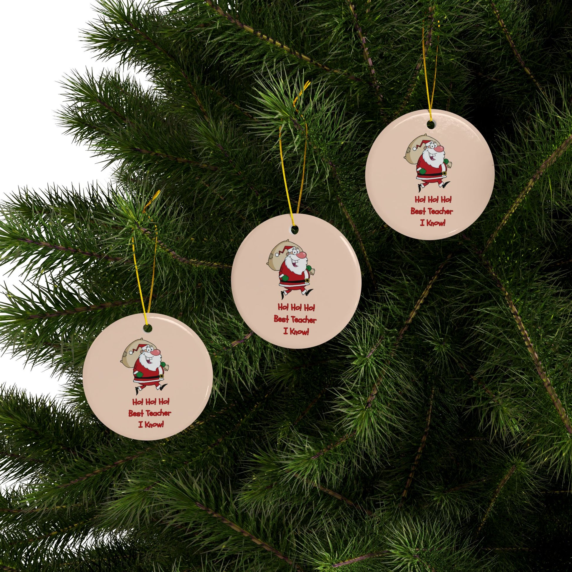 Three round Christmas ornaments with Santa Claus designs hanging on a tree.