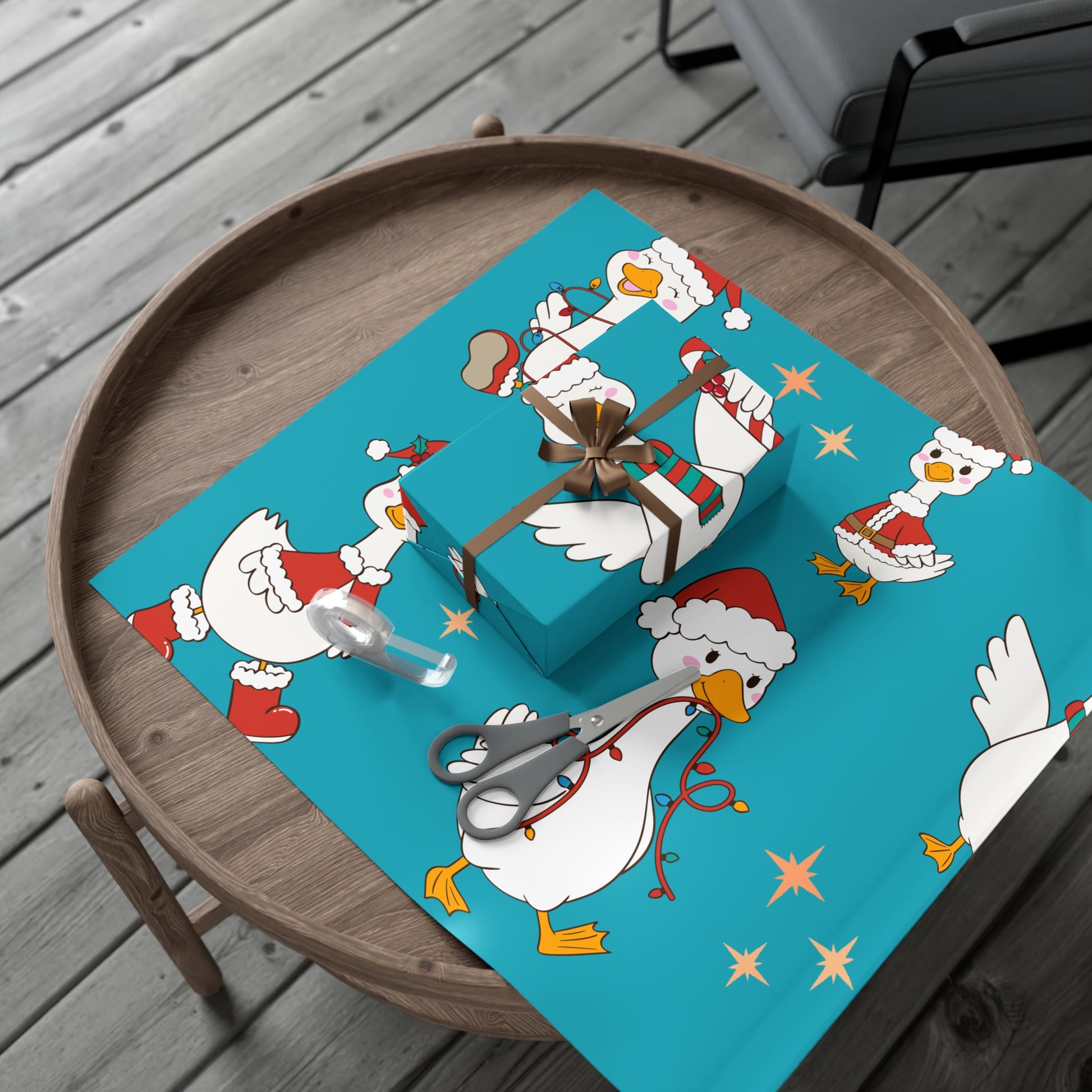 lue Christmas wrapping paper with geese wearing Santa hats.