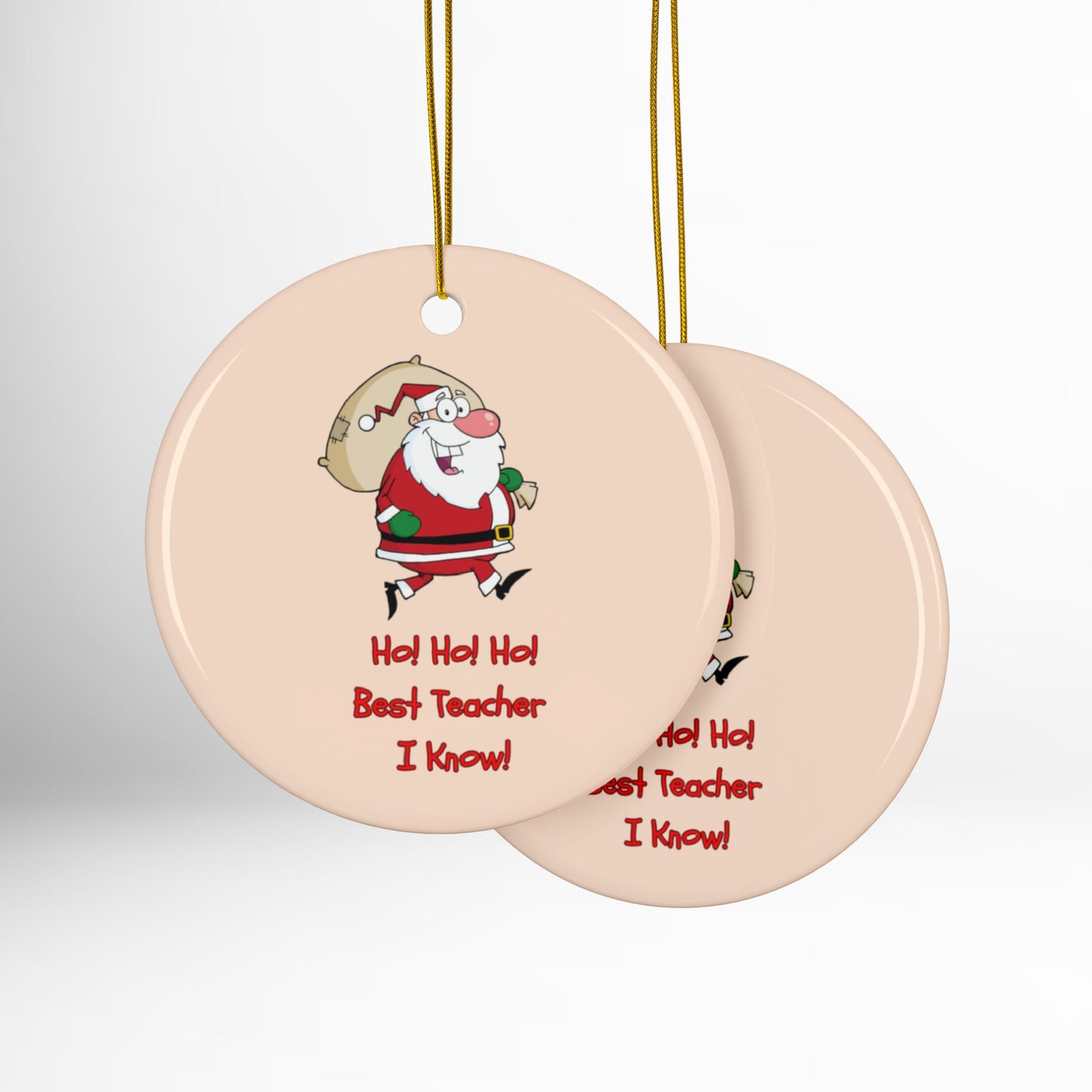 Two round ceramic ornaments with Santa Claus design and text on a white background