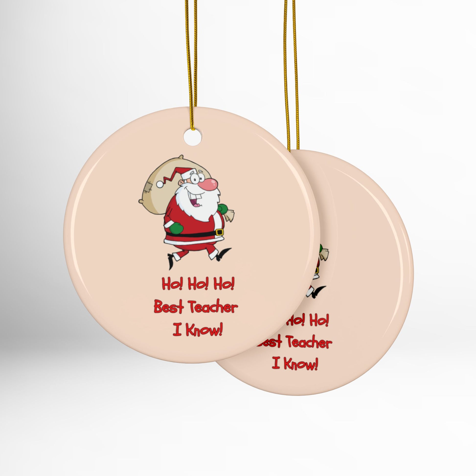 Two round ceramic ornaments with Santa Claus design and text on a white background
