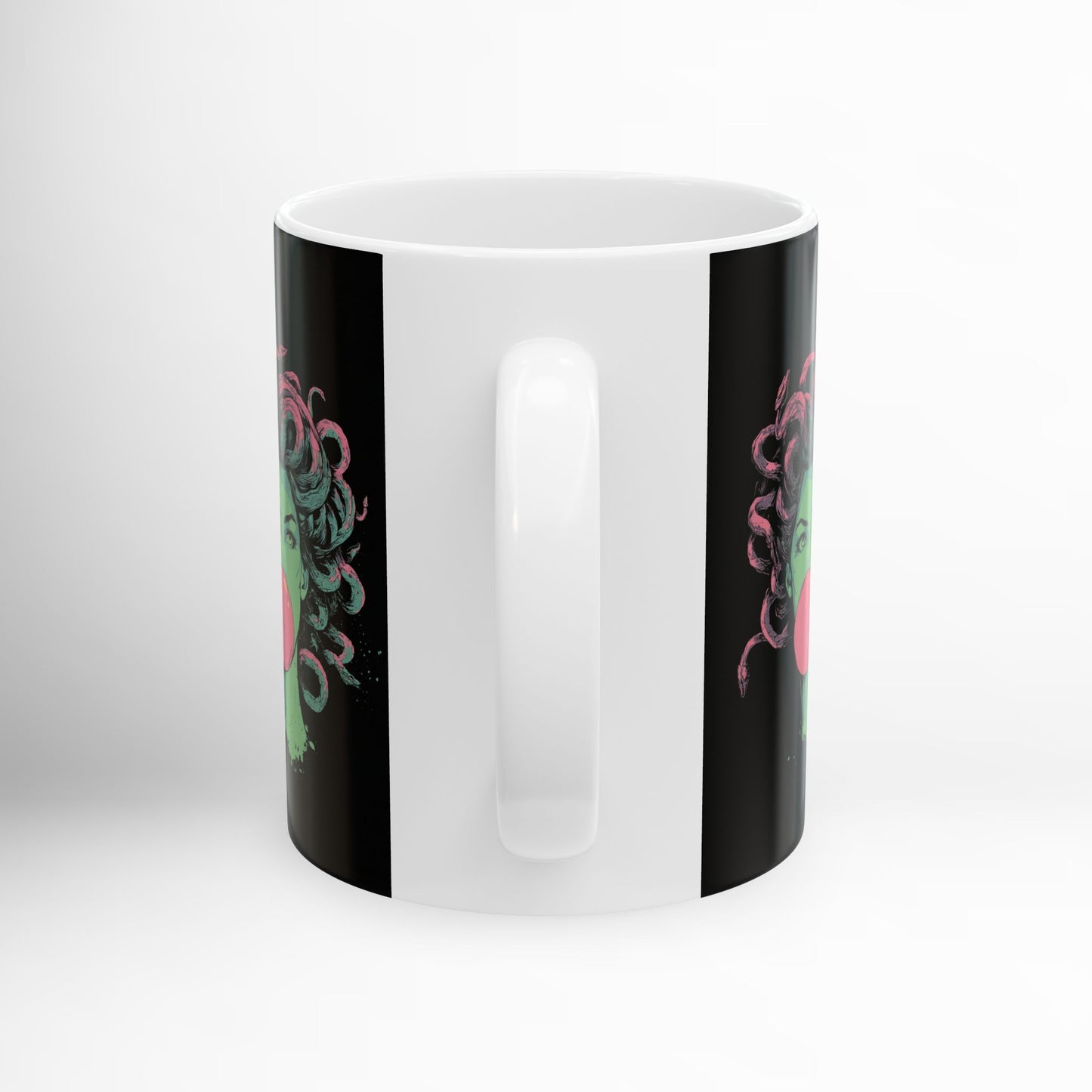 Black ceramic mug with Medusa bubblegum graphic – mythology drinkware.