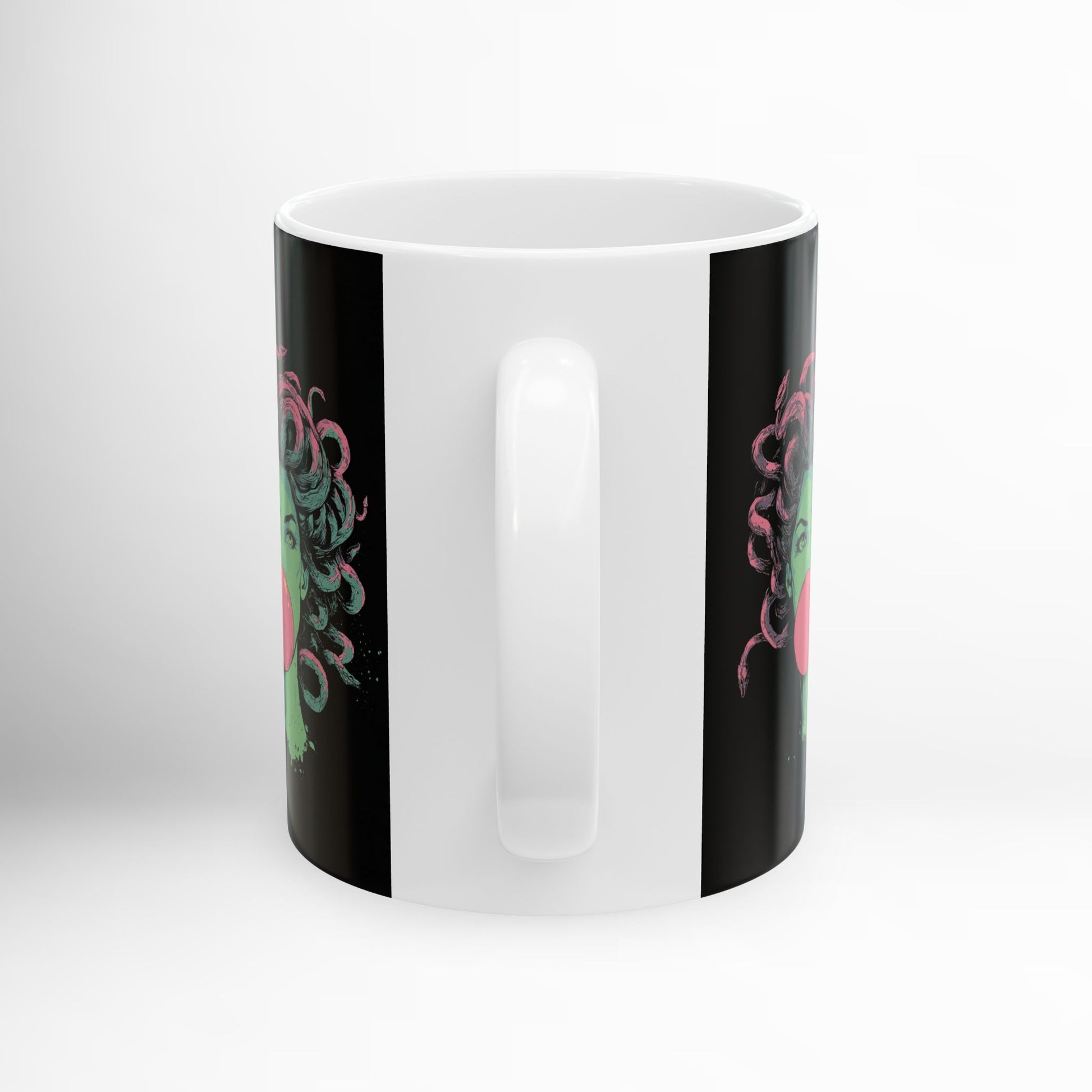 Black ceramic mug with Medusa bubblegum graphic – mythology drinkware.