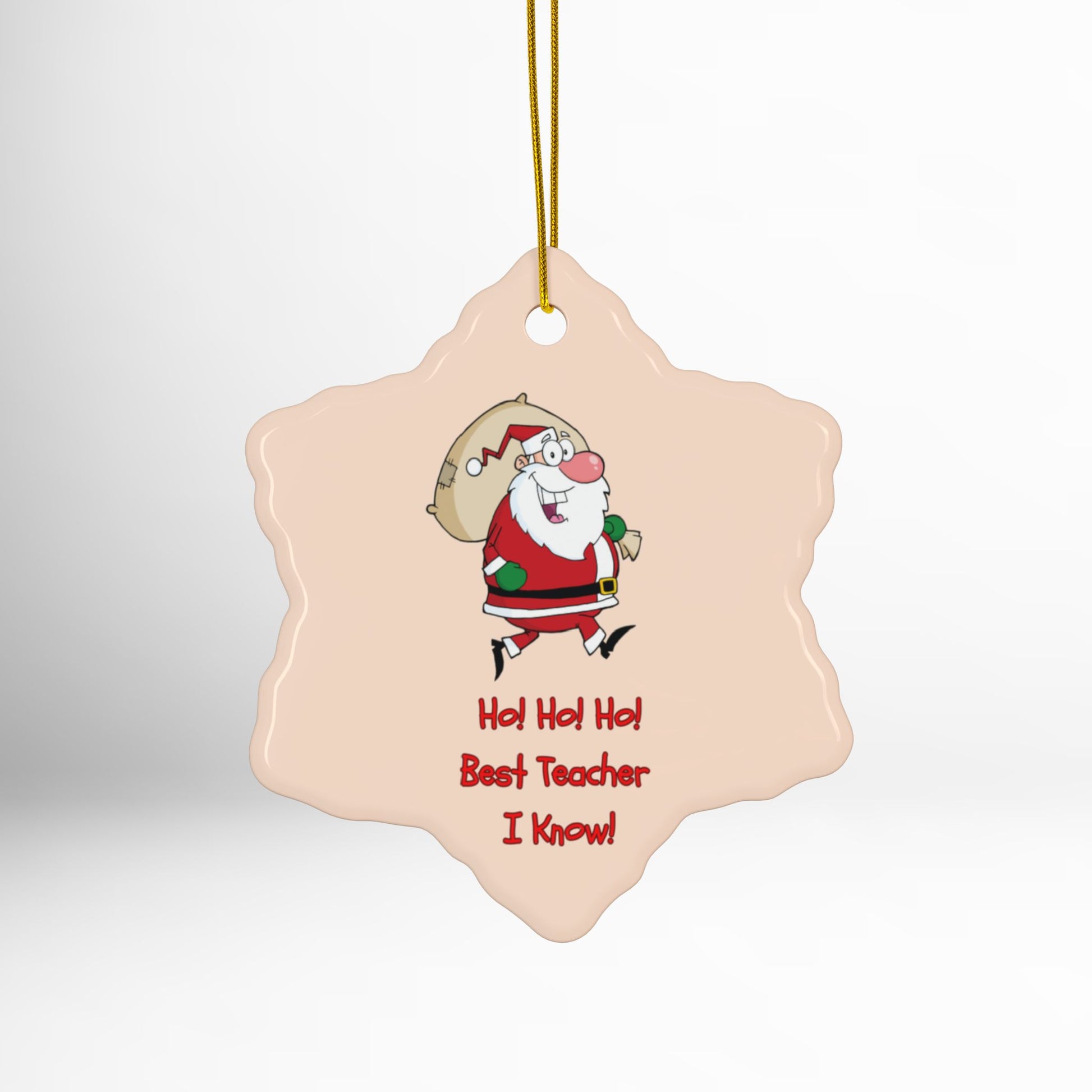 Decorative Christmas ornament with Santa Claus and text on a light pink background