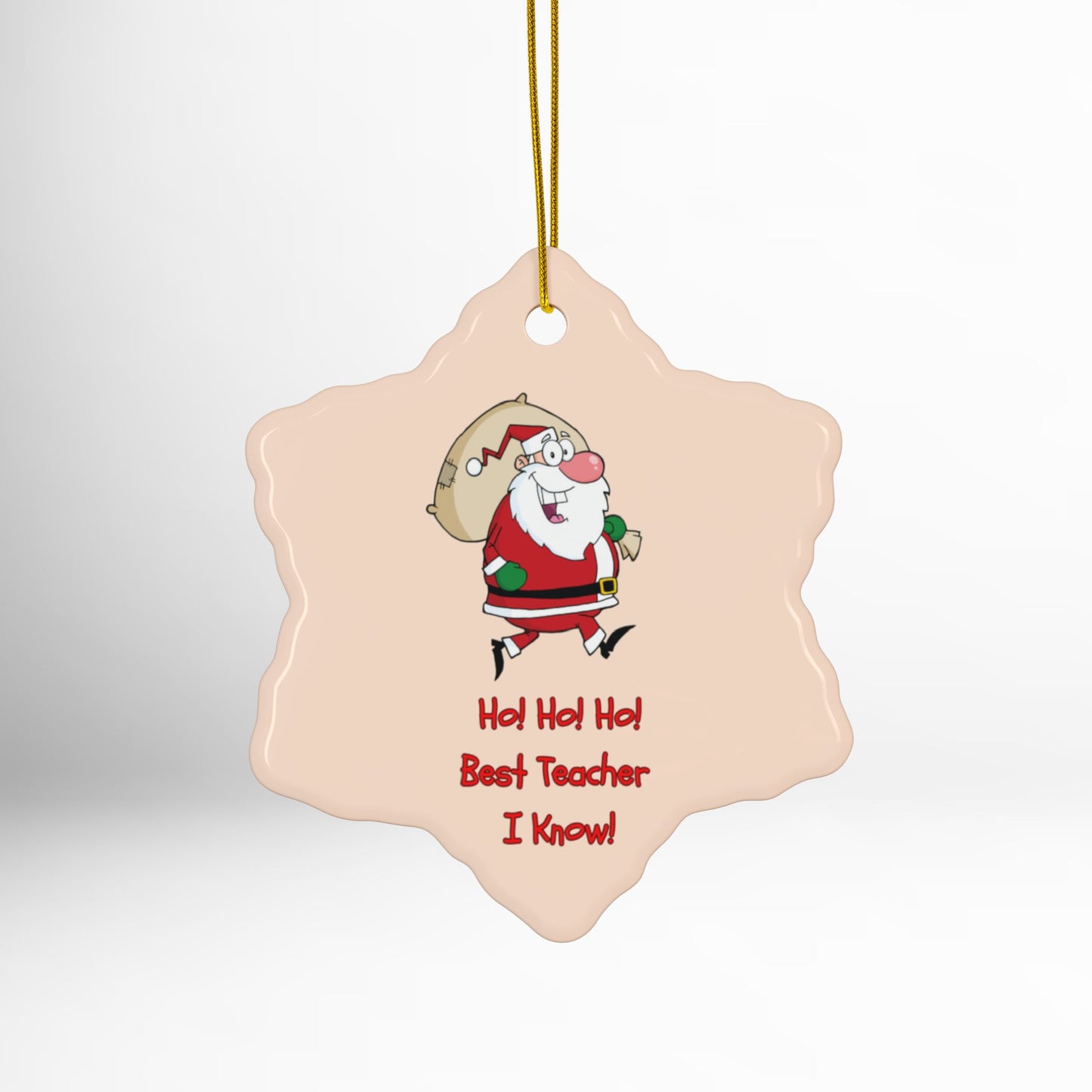 Decorative Christmas ornament with Santa Claus and text on a plain background