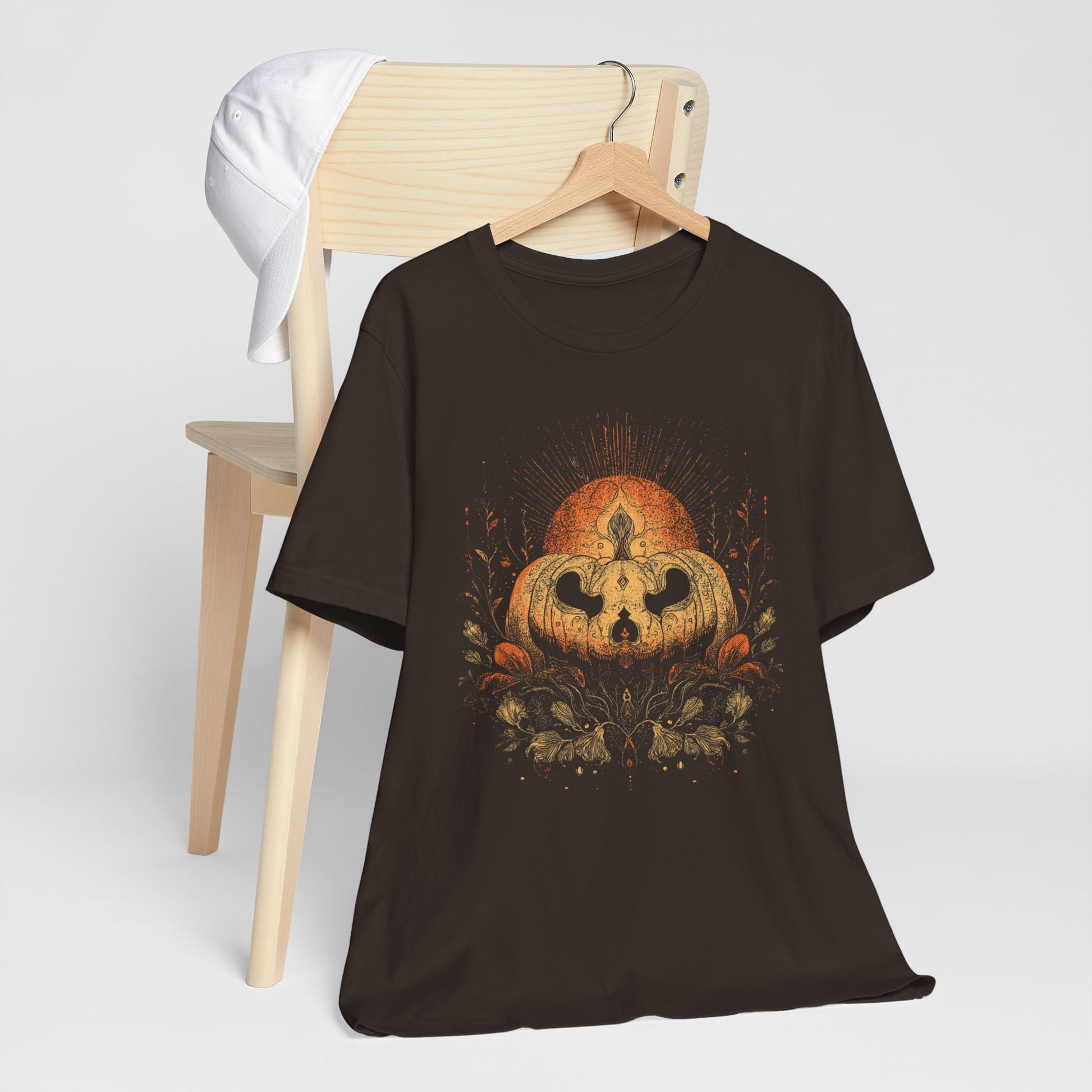 Black t-shirt with boho pumpkin candle fall graphic design.