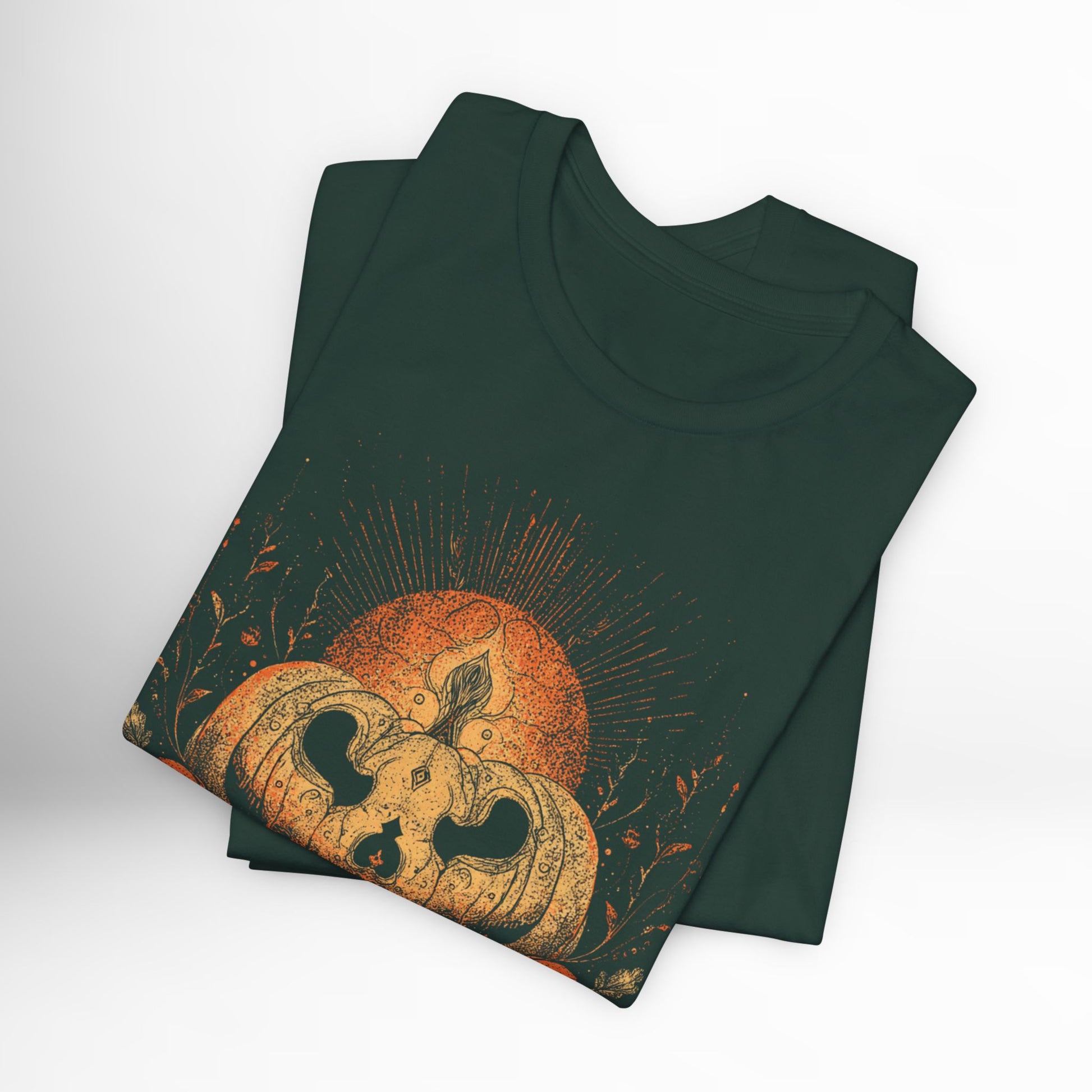 Green t-shirt with pumpkin design on a white background