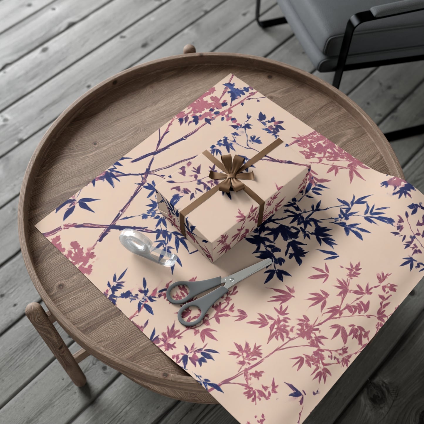 otanical floral wrapping paper with pink and blue branch design.